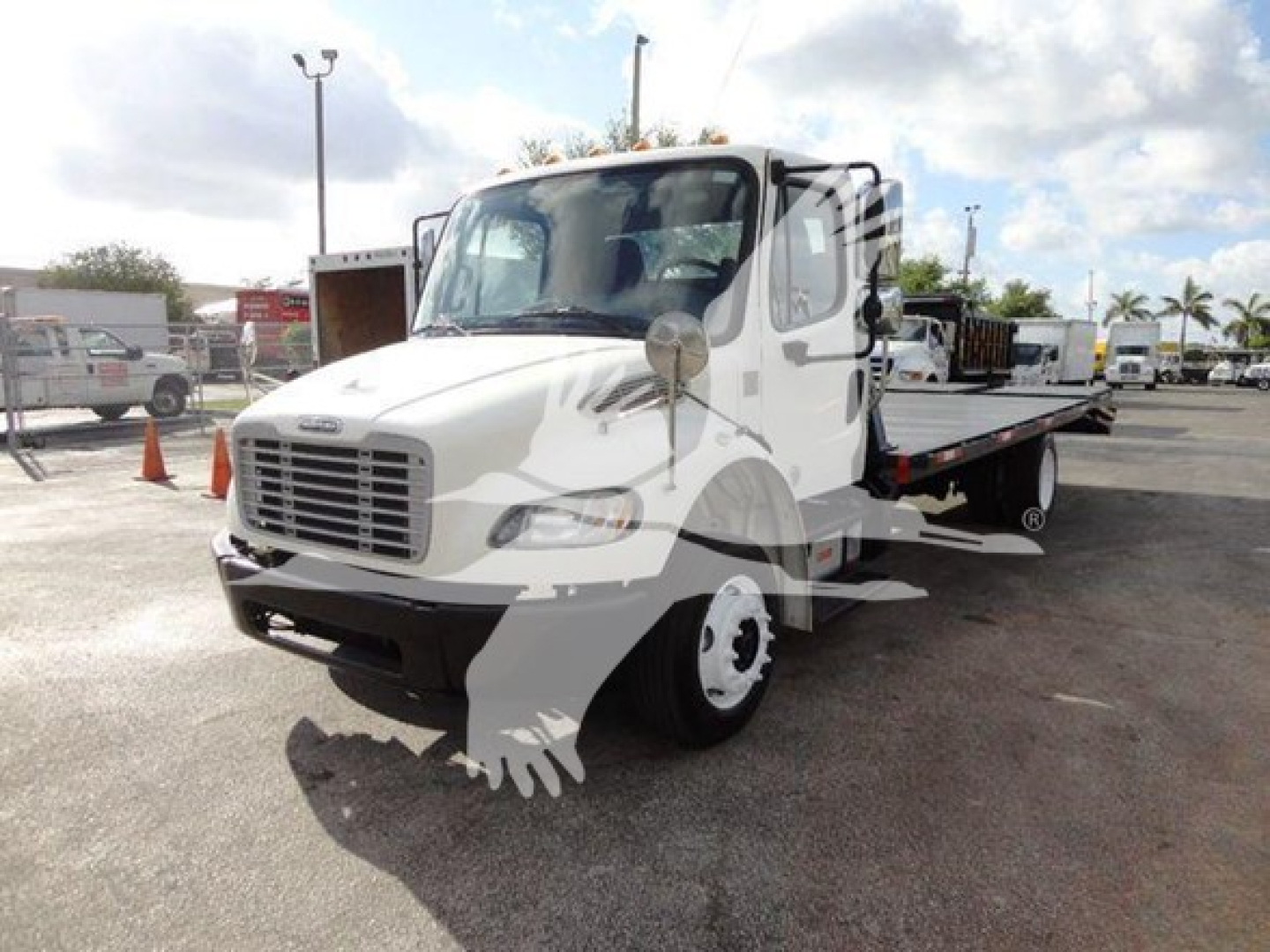 Freightliner M2 106 flatbed truck in view showing front and side, VIN 1FVACWDTXFHGR0070, stock TR0070, white cab with flatbed bed and dual rear wheels.
