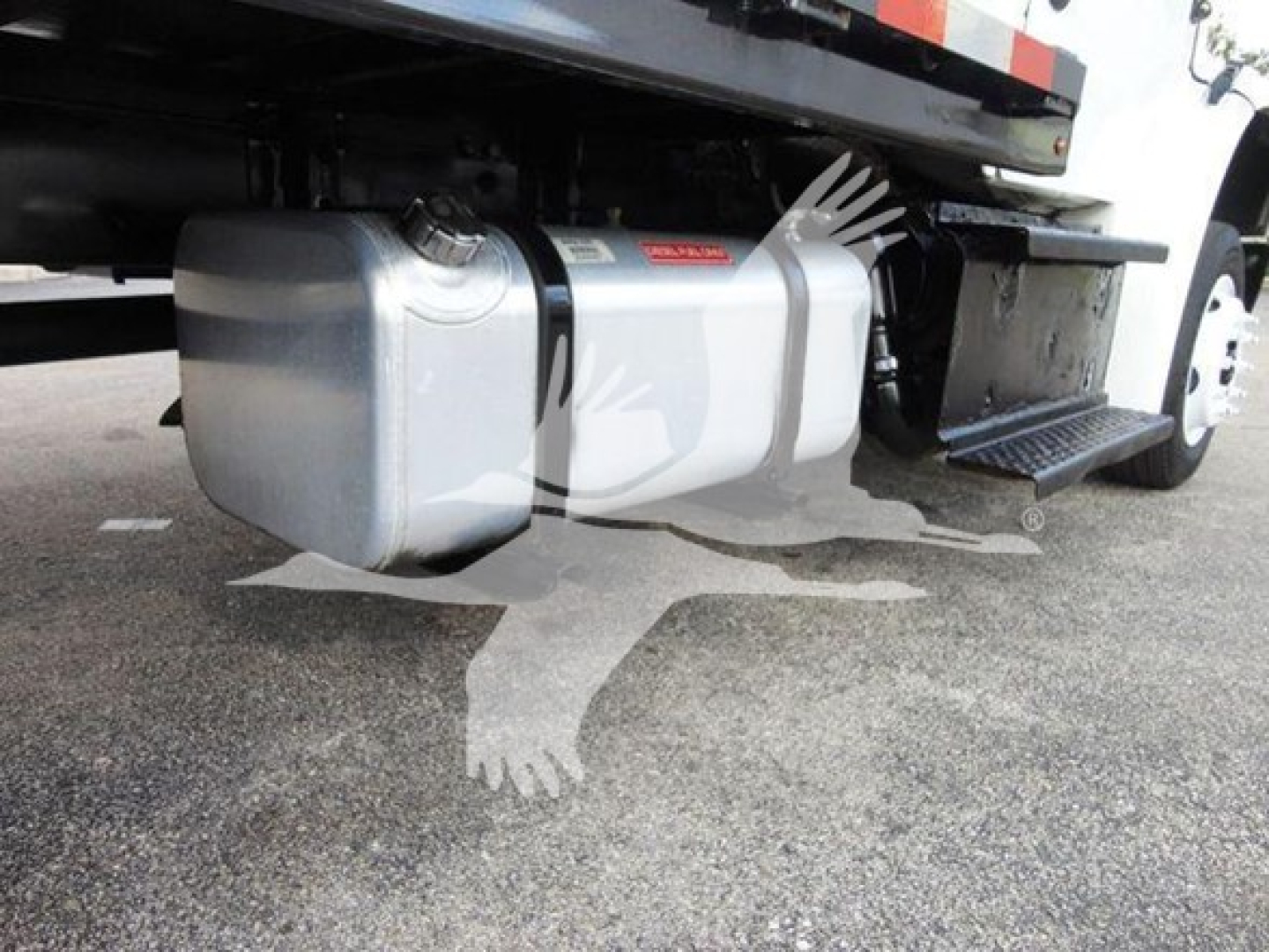 Under truck showing fuel tank and undercarriage of 2015 Freightliner M2 106 flatbed with side step.