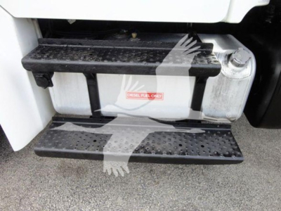 Freightliner M2 106 side step area showing fuel tank and steps with metal non-slip steps.
