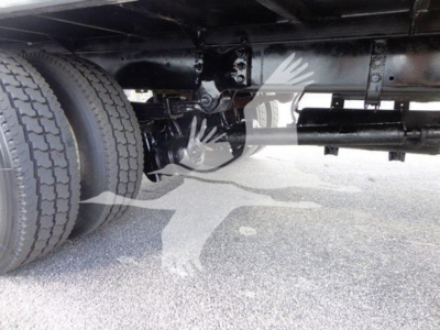 Freightliner M2 106 undercarriage showing dual rear tires and drivetrain components.