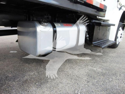 Under truck showing fuel tank and undercarriage of 2015 Freightliner M2 106 flatbed with side step.