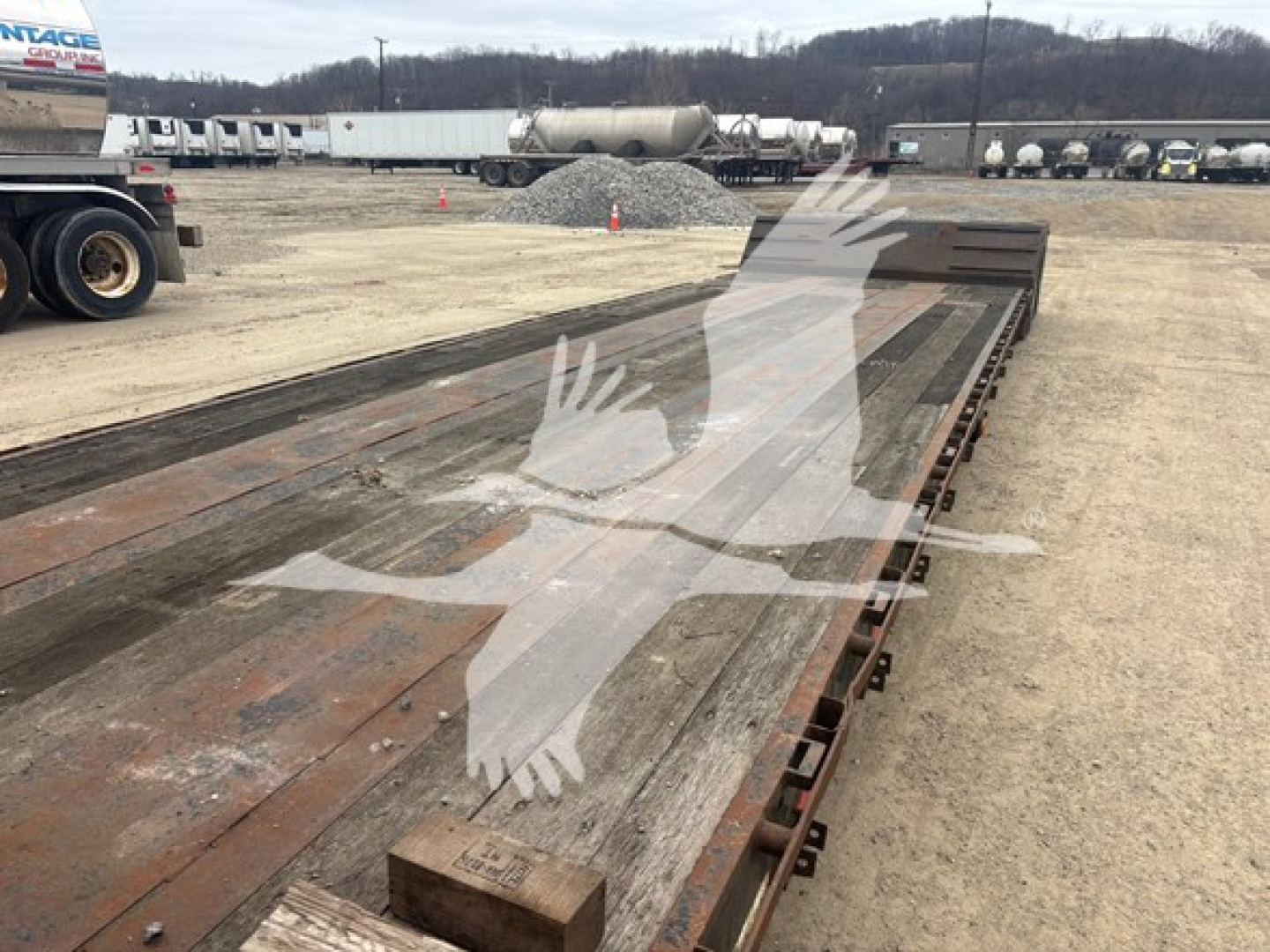 XL Specialized XL80MDE trailer in-view showing long extendable deck and dual-drop design with weathered steel surface.