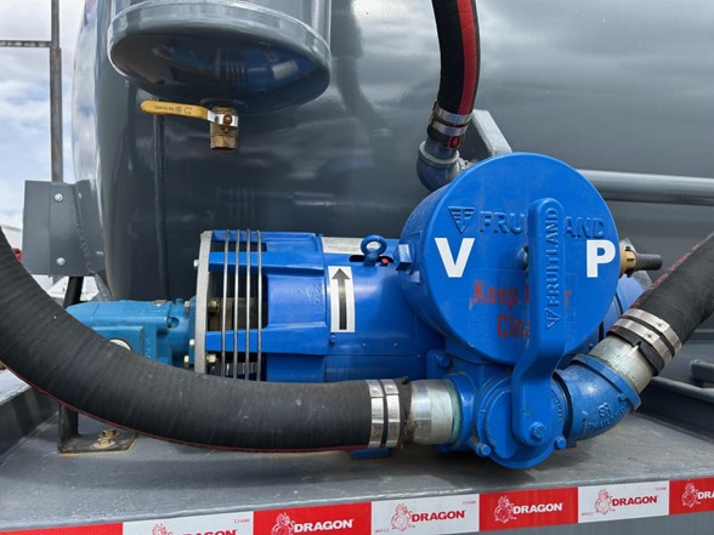 Dragon tri-axle air ride trailer pump blue high-pressure diaphragm with hoses and 'KEEP CLEAR' label