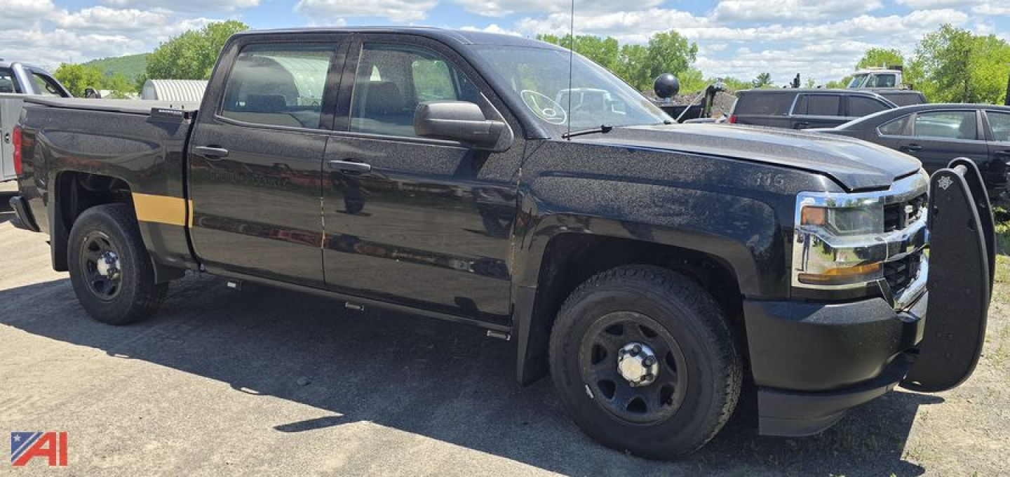 Chevrolet Silverado 1500 Crew Cab Police Vehicle in black with light bar mounts, side marker, and push bumper.