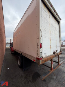 Box truck showing rear and side panels of a 2005 GMC TopKick C4500 cargo box with white rear doors and brown exterior siding.