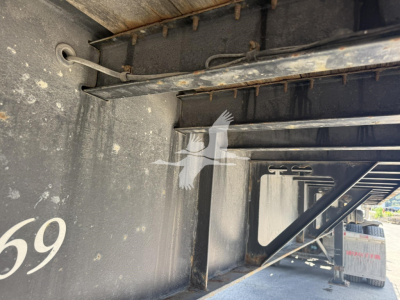 Trailer interior showing steel framing and a wheel well; visible text includes '59' on the left and structural components of the Fontaine trailer.