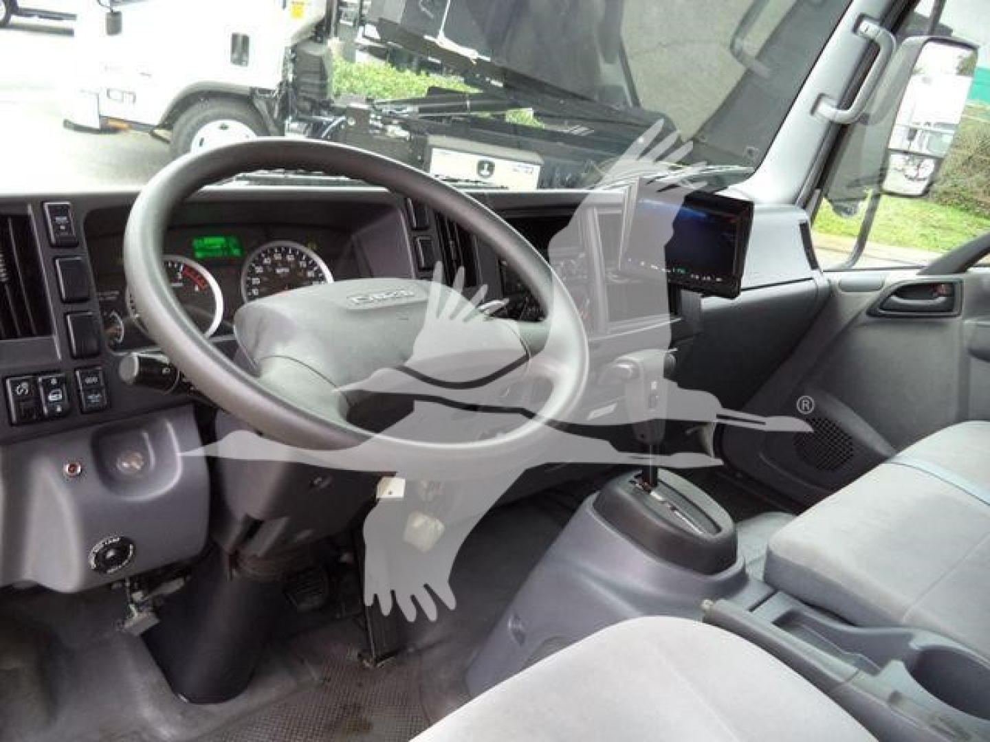 Isuzu NQR 2019 interior showing steering wheel dashboard and center console.