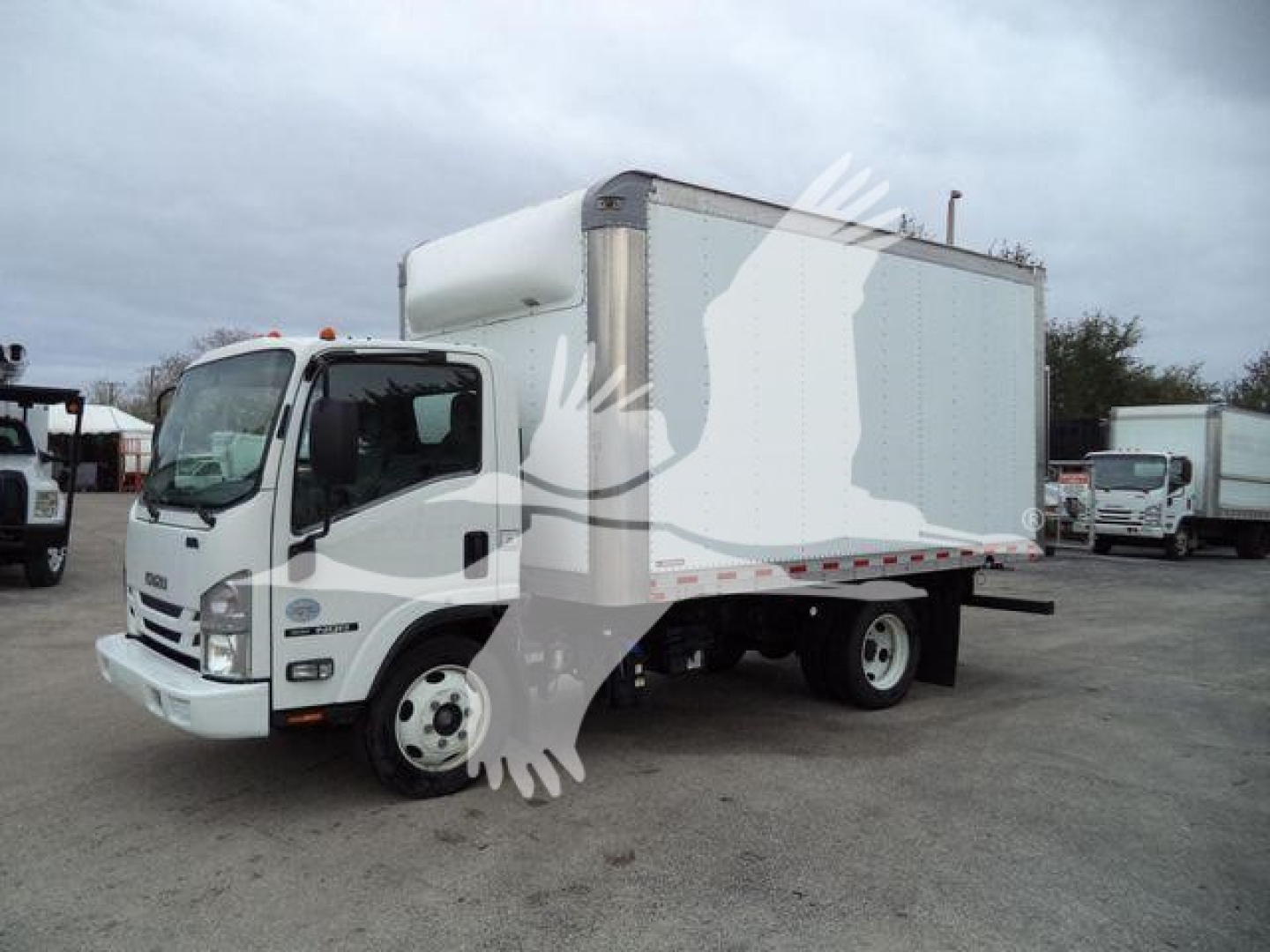 Isuzu NPR/NQR box truck in-service showing side of cargo box and cab with VIN plate area and stock number text overlay not visible.