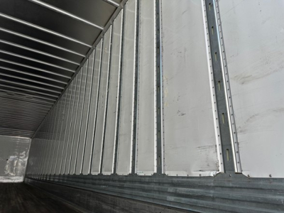Trailer interior showing corrugated metal sidewalls and ribbed ceiling of a Utility 4000dx trailer.