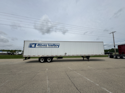 Trailer body showing River Valley trailer leasing logo on the side of a large white utility trailer.
