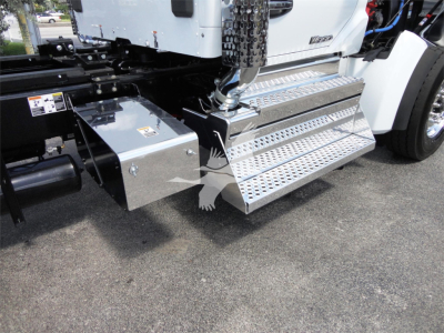 Truck side step with diamond plate and chrome exhaust intake on Kenworth W990 truck showing chrome steps and side toolbox.