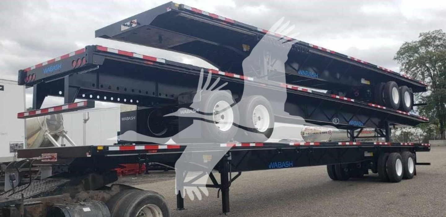 Wabash steel air slider trailer in stacked position showing flatbed with multiple axles and hydraulic lift with visible tires and frame