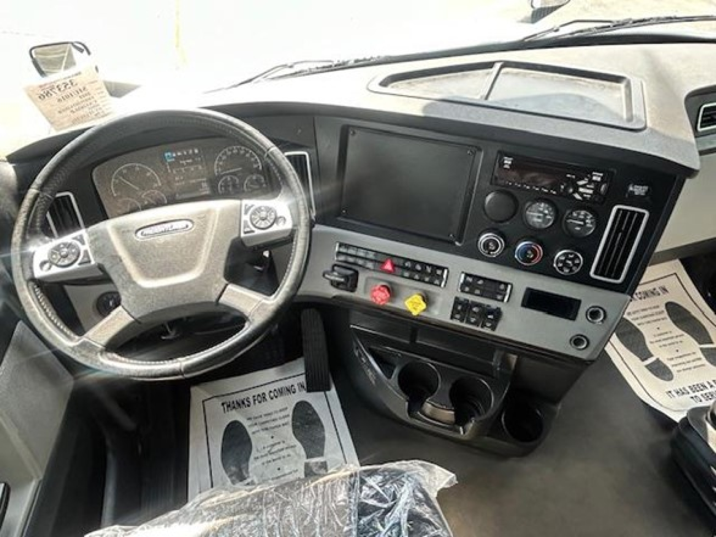 Freightliner Cascadia 126 interior dashboard and steering wheel view.