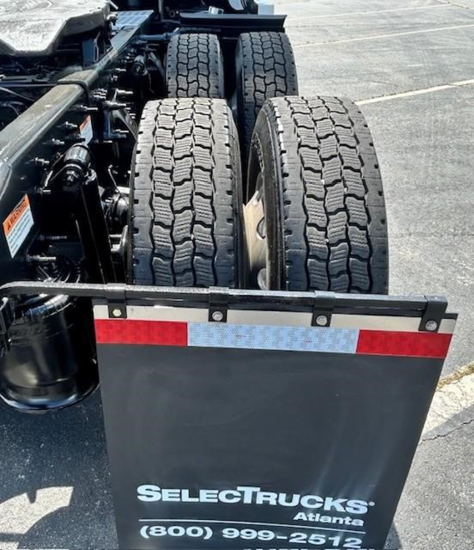 Freightliner Cascadia rear view showing dual rear axles, tires, and Concord platform with SelectTrucks Atlanta branding plate.