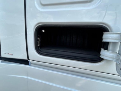  Freightliner Cascadia 126 cab door storage compartment open showing interior of the sleeper truck with blank bay