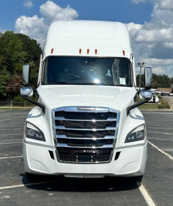 Freightliner Cascadia 126 truck front view with large grille and chrome accents.