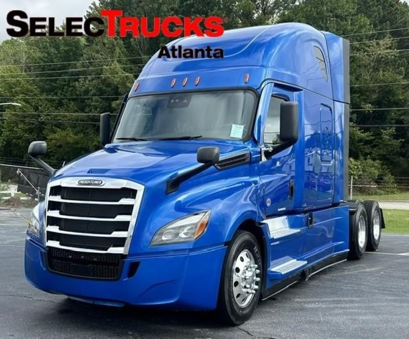 Truck cab in blue 2022 Freightliner Cascadia 126 with sleeper, front grille and headlights visible.