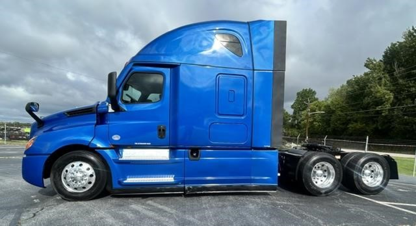 Freightliner Cascadia 126 tractor cab side profile showing blue paint and sleeper configuration.