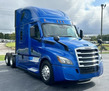 Freightliner Cascadia 126 truck in blue side view showing sleeper cab and chrome grille.