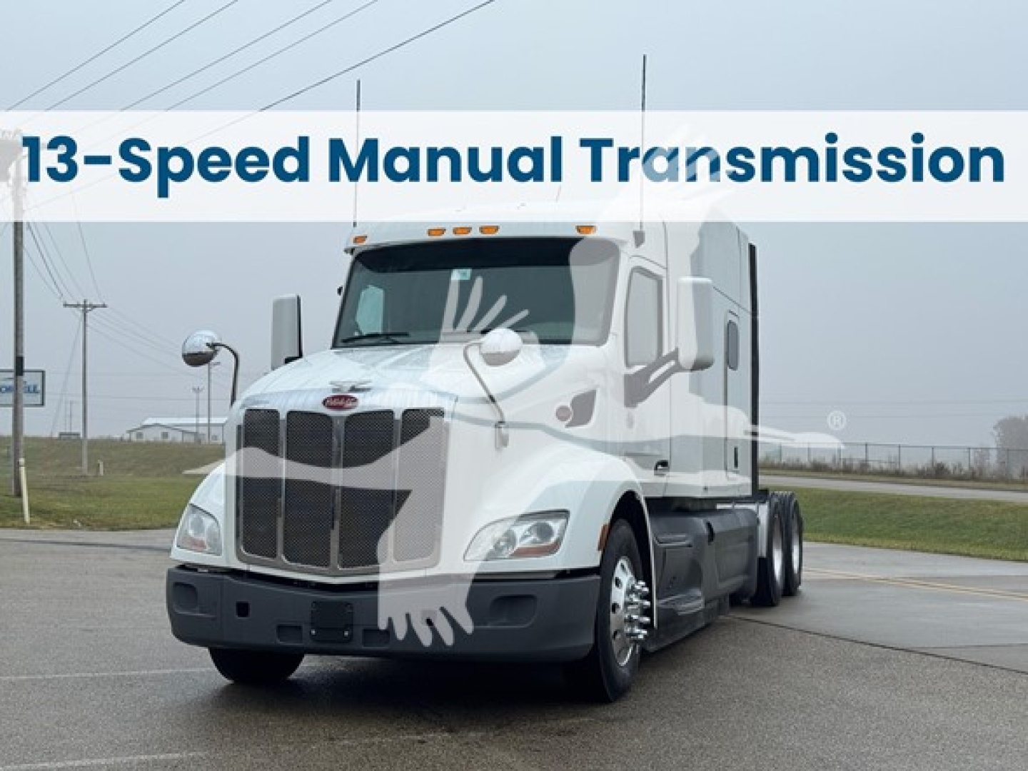 Peterbilt 579 truck with a 13-Speed Manual Transmission banner across the top, front view showing grille and headlights.