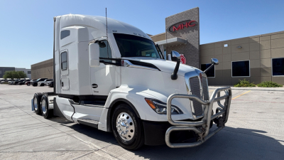 Kenworth T680 tractor in front view showing chrome bumper guard and side mirrors