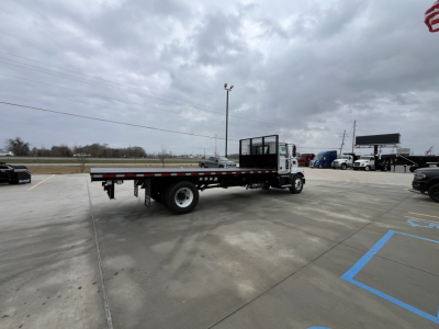 Flatbed tow truck chassis in lot with extended low-profile bed and flatbed trailer, Mack MD6 new truck, VIN 1M2MDBAA4TS019616, stock 71461.