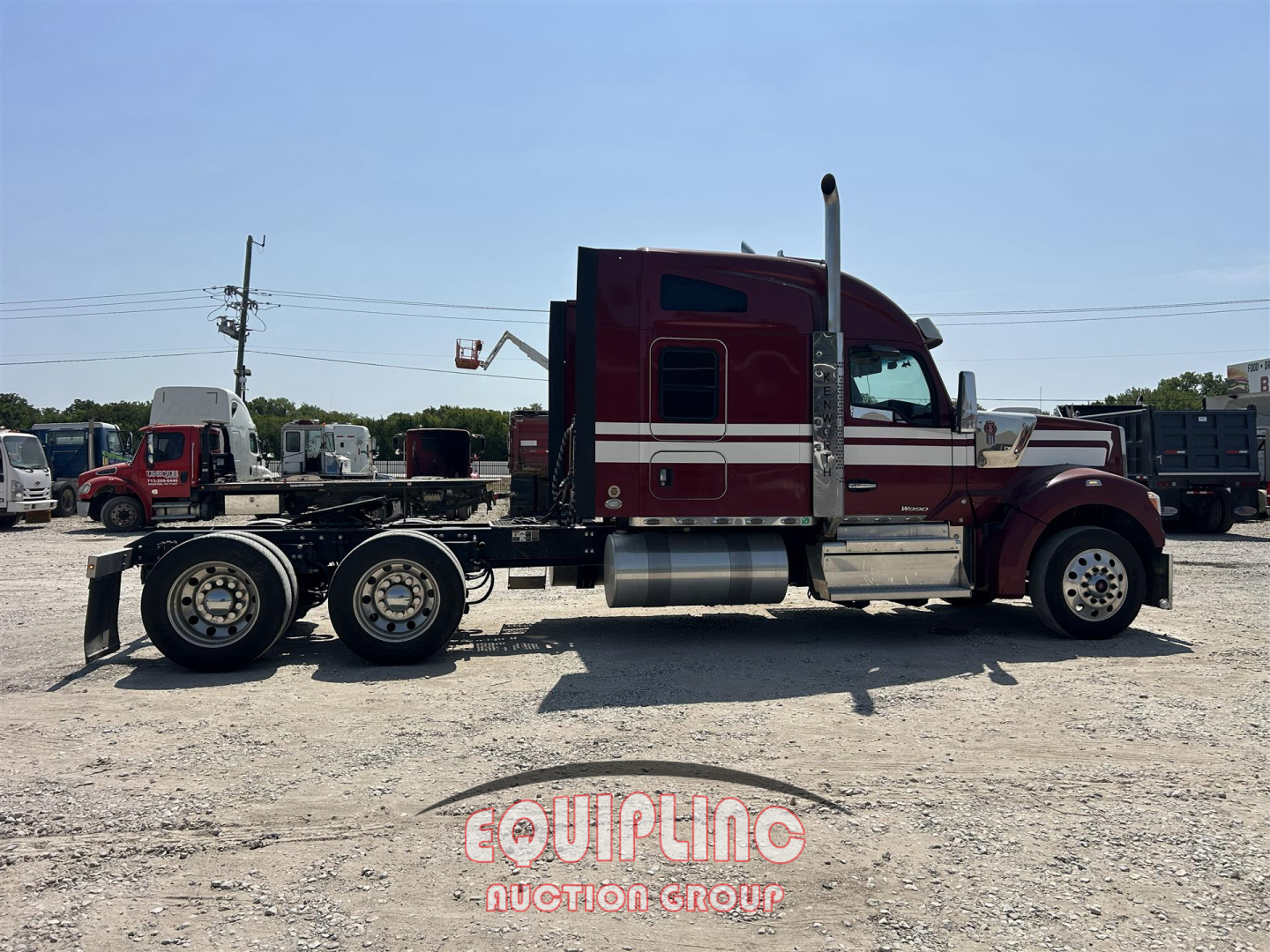 Kenworth W900 2021 conventional sleeper pickup truck side view showing long hood, dual rear axles, chrome fuel tanks, and hood air intake
