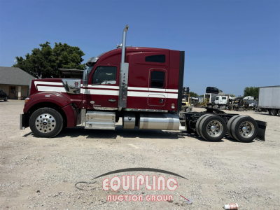 Kenworth W900 class-8 tractor truck side view showing sleeper cab, dual rear axles, red paint with white stripe, chrome fuel tanks, exhaust stack.