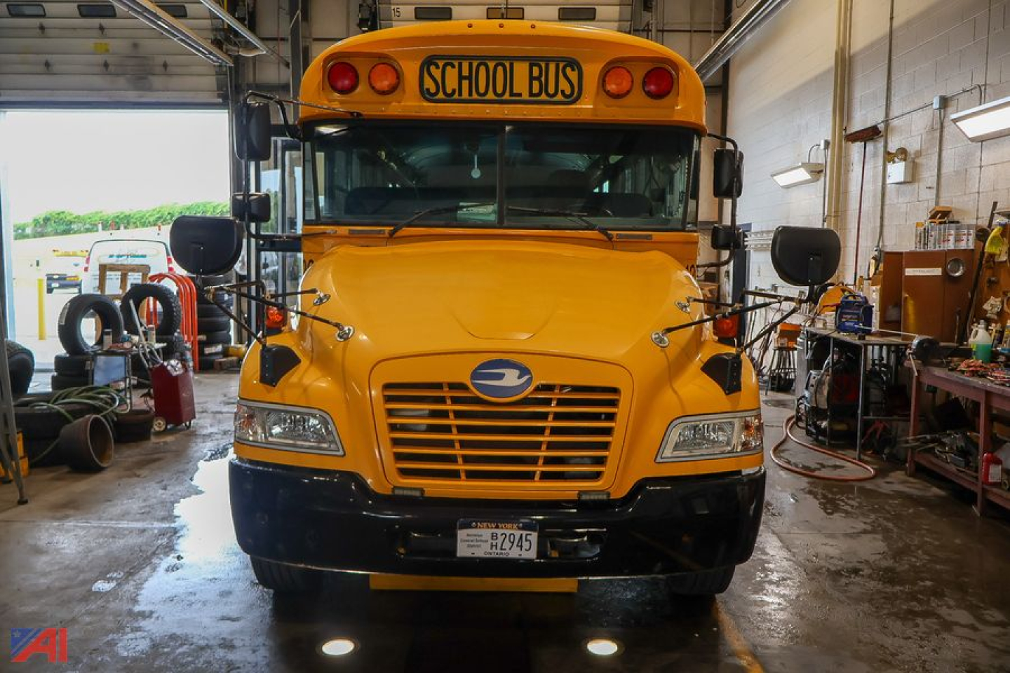 Front view of a yellow 2017 Blue Bird Vision school bus showing headlights, grille, and a 'SCHOOL BUS' sign above the windshield.