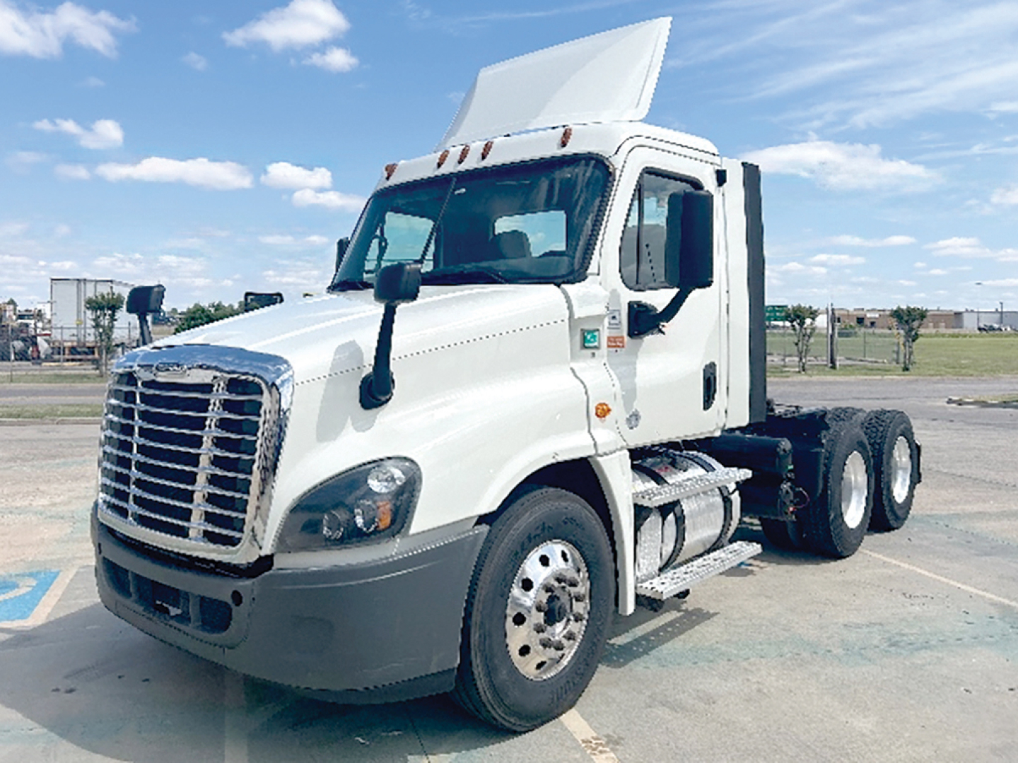 2018 Freightliner Cascadia125 conventional daycab truck showing front grille, windshield, cab, and side mirror.