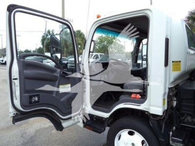 Isuzu NPR-XD cab interior and door area showing open driver door with dashboard and steering wheel visible