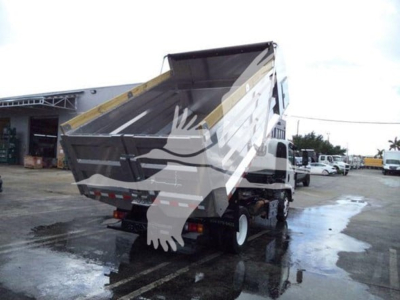 Isuzu NPR XD dump truck rear/side view showing tilted bed and hydraulic mechanism.