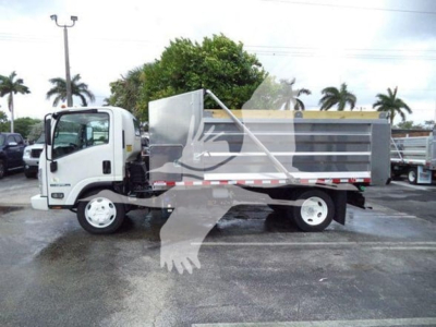 Isuzu NPR XD dump truck side view showing cargo bed and cab with white wheels.