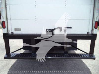 Isuzu NRR truck rear showing drop-down step bumper and cargo box in-use with stock number T00719.