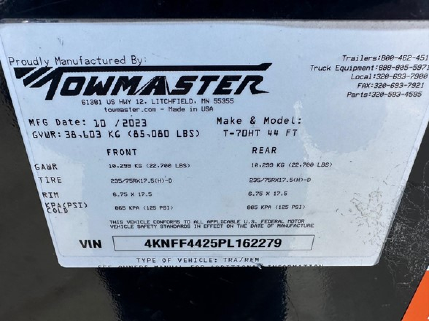 Towmaster trailer identification plate showing GVWR 36,103 KG (65,000 LBS) front/rear GAWR values, tire size 235/75R? on rims, VIN 4KNFF4425PL162279, MFG date 10/2023, Make & Model T-70HT 44 FT.