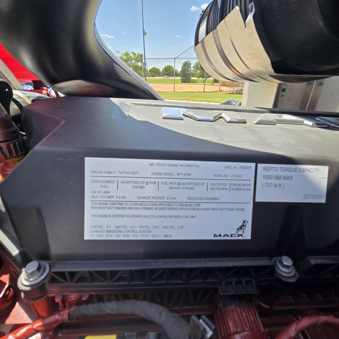 Mack GR64B engine bay label showing immediate engine information and serial details.