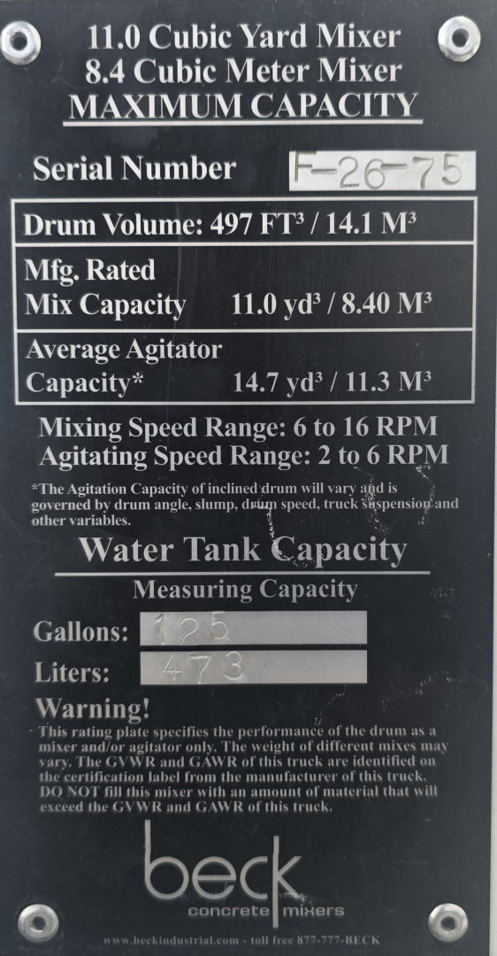 Mack mixer identification plate showing 11.0 Cubic Yard Mixer, 8.4 Cubic Meter Mixer, Serial Number F-?  - Part of mixer body with capacity details, drum volume 497 ft³ / 14.1 m³, mix capacity 11.0 yd³ / 8.40 m³, average agitator capaci