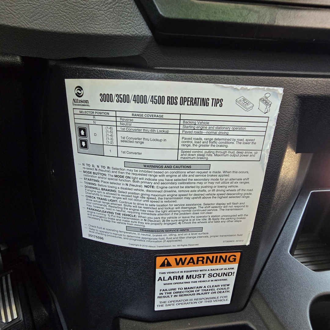 Truck dashboard sticker showing operating tips for Allison 3000/3500/4000/4500 RDS, including selector positions, range coverage, warnings and cautions, and a yellow warning label that says ALARM MUST SOUND.