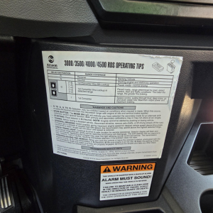Truck dashboard sticker showing operating tips for Allison 3000/3500/4000/4500 RDS, including selector positions, range coverage, warnings and cautions, and a yellow warning label that says ALARM MUST SOUND.