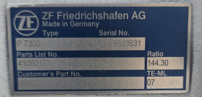 Plate showing ZF Friedrichshafen AG label with Part List No. 41008177, P7300, Serial No. 9333631, Customer's Part No. 66000, TE-ML 07, Ratio 144.30, Made in Germany.