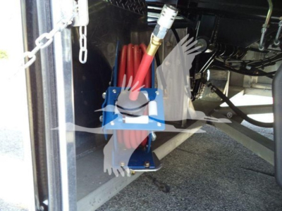 Kenworth T280 rollback truck undercarriage showing red coiled air hose and blue mounting bracket.