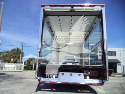 Kenworth T280 rollback truck rear view showing cargo area and rear doors.