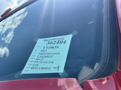 Truck windshield with a pink Freightliner Cascadia tag showing stock number 362404, VIN partial U0639, 2023 model, DD-15, DT-12(auto), 2.16  best choice.
