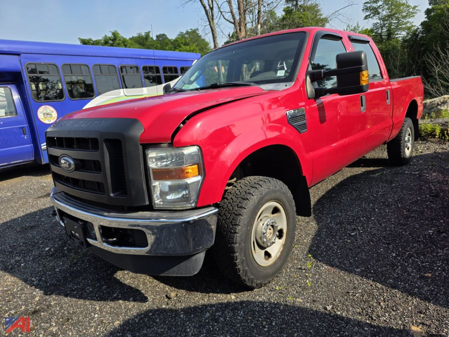 Ford F-250 Super Duty pickup truck red extended cab 4x4 with black grille and chrome bumper, side view, in a lot.