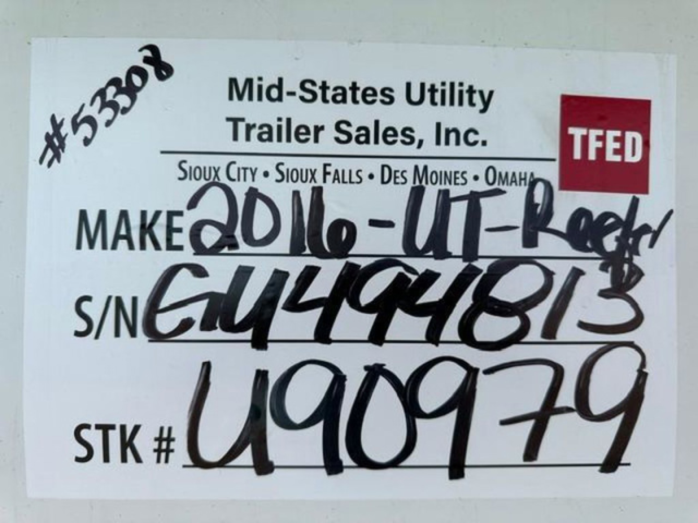 Trailer tag showing Mid-States Utility Trailer Sales, Inc. branding and handwritten make/model, serial, and stock numbers. TFED logo visible.