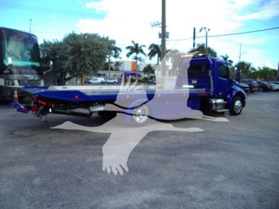 Peterbilt 536 rollback tow truck in blue with flatbed, side view showing rear hitch and wheel, stock BLUE536STEPSIDE, new unit.