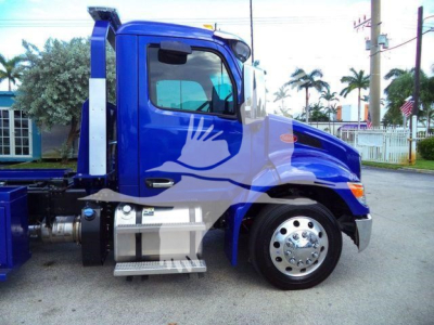 Peterbilt 536 Rollback truck side view showing blue cab and chrome fuel tank