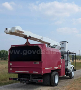Truck bucket lift with hydraulic boom, bucket body in maroon, cab in white, rear view with extended boom.