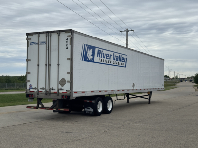 Trailer side and rear showing River Valley Trailer Leasing logo on a white utility 4000Dx trailer, with dual rear doors and Mississippi license style numbers.