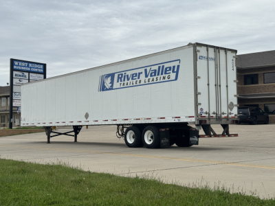 Trailer side view showing River Valley Trailer Leasing logo on a white utility trailer.